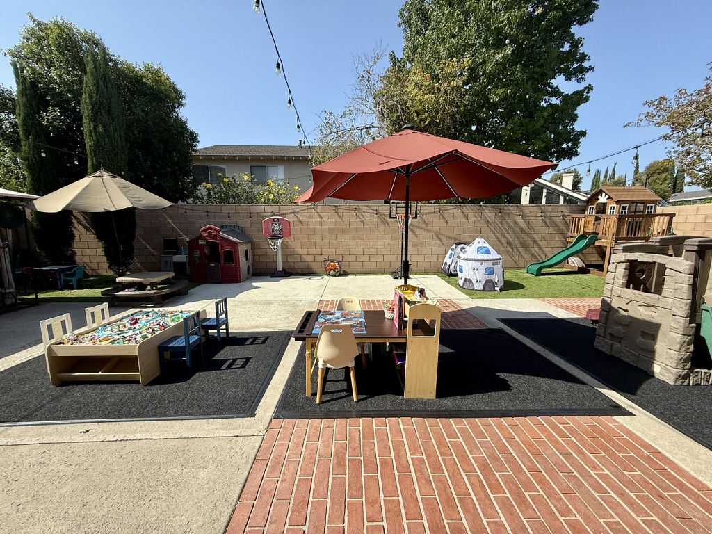 Shaded outdoor tables for learning and play